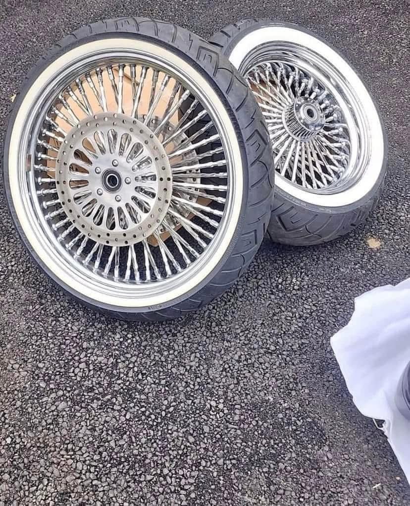 Chrome spokes wheels and white walls tires